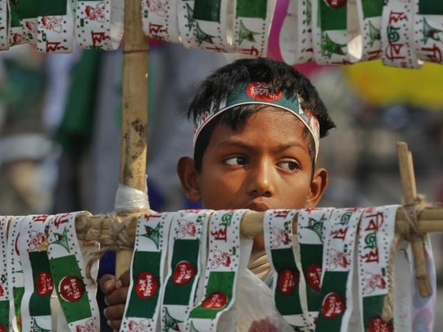 A child sells headbands during the Victory Day celebrations. Bangladesh observed its Victory Day on Wednesday to mark the defeat of Pakistan in 1971, when the country became independent after a nine-month war, against the backdrop of calls for Dhaka to cut ties with Islamabad for its denial of the genocide during the hostilities.(AP) A child sells headbands during the Victory Day celebrations. Bangladesh observed its Victory Day on Wednesday to mark the defeat of Pakistan in 1971, when the country became independent after a nine-month war, against the backdrop of calls for Dhaka to cut ties with Islamabad for its denial of the genocide during the hostilities.(AP)