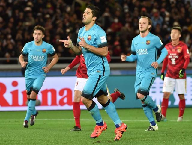 Barcelona forward Luis Suarez celebrates his goal against Guangzhou Evergrande during their Club World Cup semi-final football match in Yokohama.(AFP Photo)