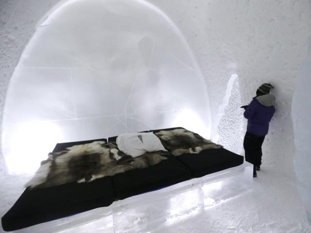 A woman checking out her room in the hotel. This year, the hotel features 50 rooms and 19 individually themed and hand-crafted art suites. (REUTERS) 