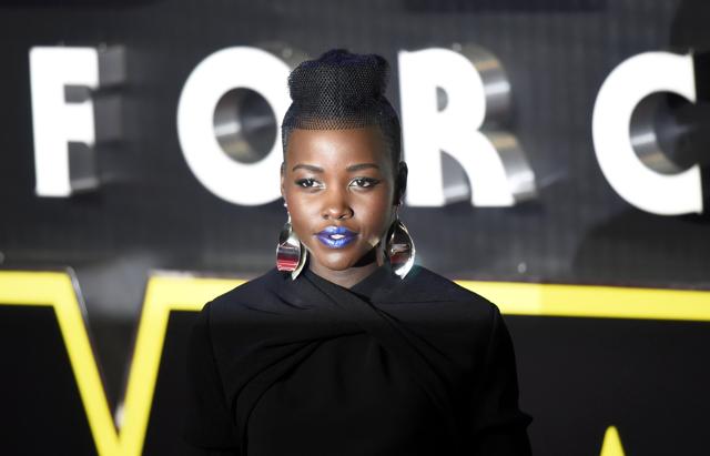 Actor Lupita Nyong'o stuns with her azure lip colour as she arrives at the European Premiere of Star Wars: The Force Awakens in Leicester Square. (REUTERS) Actor Lupita Nyong'o stuns with her azure lip colour as she arrives at the European Premiere of Star Wars: The Force Awakens in Leicester Square. (REUTERS)