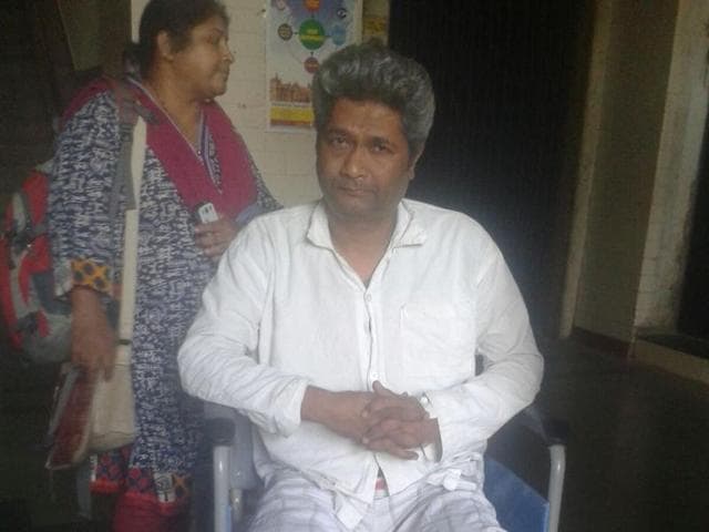 Motorman Shrikant Balkrishna Kotuwar suffered injuries to his chest after an iron sheet fell shattered the front glass in the motorman’s cabin on Thursday. (Praful Gangurde) Motorman Shrikant Balkrishna Kotuwar suffered injuries to his chest after an iron sheet fell shattered the front glass in the motorman’s cabin on Thursday. (Praful Gangurde)