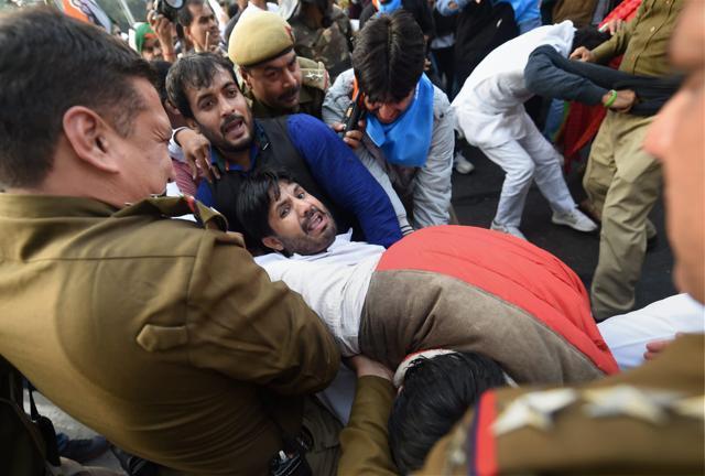 Youth Congress President Amrinder Singh Raja being detained by police during protest against the central government regarding National Herald Case at Teen Murti. (PTI) Youth Congress President Amrinder Singh Raja being detained by police during protest against the central government regarding National Herald Case at Teen Murti. (PTI)