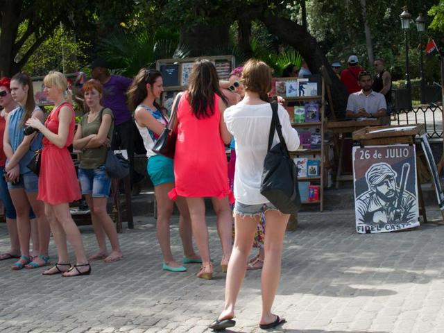 Tourists visit the Old Havana, a UNESCO World Heritage Site, on December 16, 2015. (AFP)