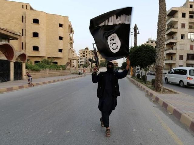A member loyal to the Islamic State in Iraq and the Levant (ISIL) waves an ISIL flag in Raqqa June 29, 2014. (Reuters) A member loyal to the Islamic State in Iraq and the Levant (ISIL) waves an ISIL flag in Raqqa June 29, 2014. (Reuters)