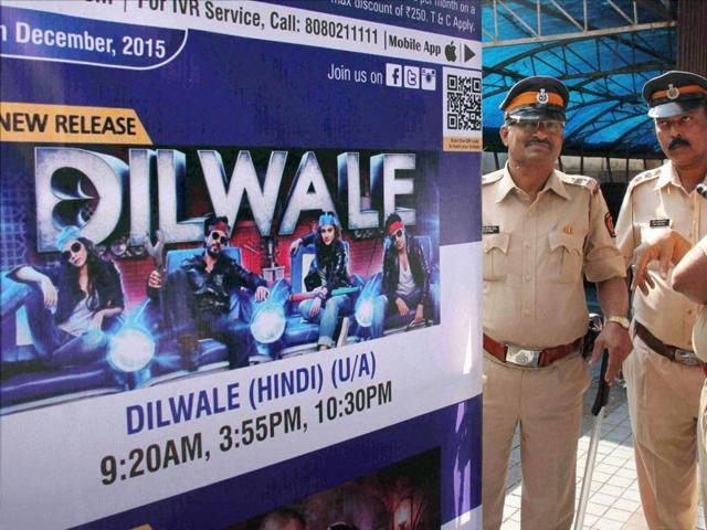 Policemen guard outside a cinema hall in the view of Hindu Rashtriya Sena's protest against Shah Rukh Khan's Dilwale in Mumbai on Friday. (PTI)