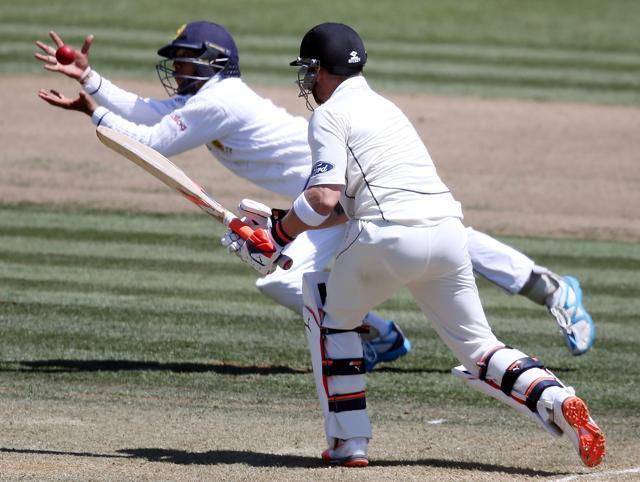 Kusal Mendis of Sri Lanka takes a catch to dismiss Brendon McCullum of New Zealand during day two of the International Test cricket match between New Zealand and Sri Lanka at Seddon Park in Hamilton. (AFP Photo)