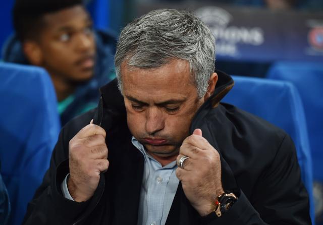 (FILES) A picture taken on November 4, 2015 shows Chelsea's Portuguese manager Jose Mourinho pulling up the collar on his coat during a UEFA Chamions league group stage football match between Chelsea and Dynamo Kiev. (AFP)