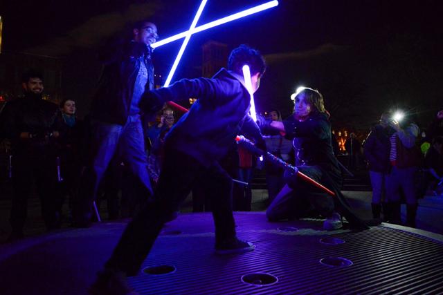People participate in a Star Wars themed lightsaber battle in Washington Square Park in New York, December 18, 2015. (REUTERS) People participate in a Star Wars themed lightsaber battle in Washington Square Park in New York, December 18, 2015. (REUTERS)