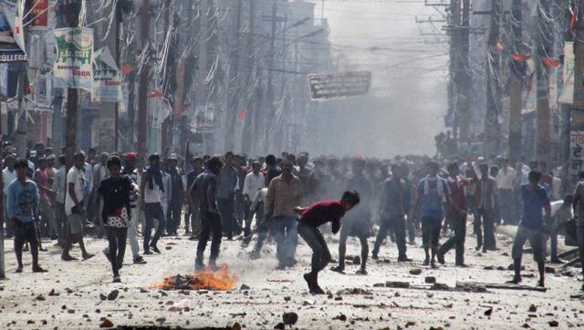 Madhesi protesters throw stones and bricks at Nepalese policemen in Birgunj, a town on the border with India. The agitation has been on for four months and has claimed 50 lives. (AP File Photo)
