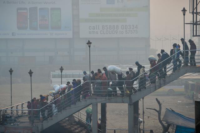 Commuters walk down the stairs of a footbridge near a bus station in the New Delhi’s Anand Vihar. There are already more than 8.5 million vehicles on Delhi’s roads with 1,400 new cars being added every day as incomes rise. (AFP) Commuters walk down the stairs of a footbridge near a bus station in the New Delhi’s Anand Vihar. There are already more than 8.5 million vehicles on Delhi’s roads with 1,400 new cars being added every day as incomes rise. (AFP)