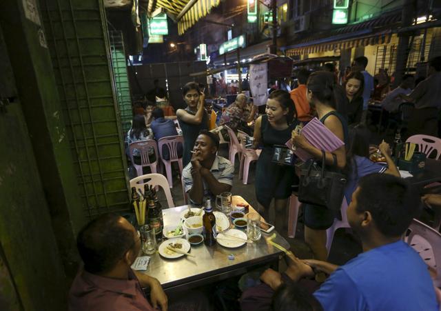 People drink beer in 19th street, also known as Yangon Beer Street in Yangon. Capturing the loyalty of the growing number of young drinkers will be as important as keeping the existing customer base, said Hiroshi Fujikawa, the managing director of MBL. (Reuters) People drink beer in 19th street, also known as Yangon Beer Street in Yangon. Capturing the loyalty of the growing number of young drinkers will be as important as keeping the existing customer base, said Hiroshi Fujikawa, the managing director of MBL. (Reuters)