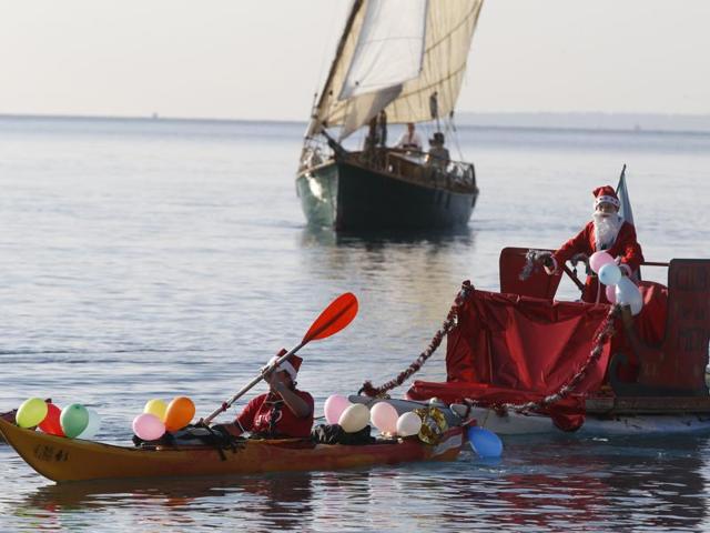 People dressed as Santa Claus attend the traditional Christmas bath in the Mediterranean Sea in the French riviera city of Nice, southeastern France. (AFP) People dressed as Santa Claus attend the traditional Christmas bath in the Mediterranean Sea in the French riviera city of Nice, southeastern France. (AFP)