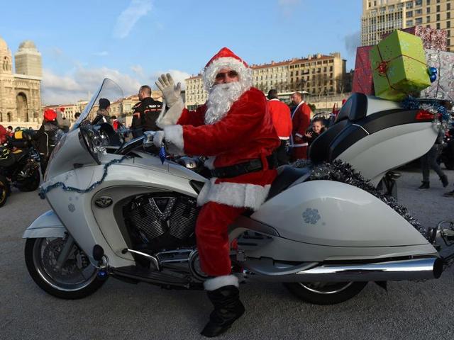 A biker dressed as Santa Claus drives in front of the MUCEM (The Museum for Europe and the Mediterranean) in Marseille, France. (AFP) A biker dressed as Santa Claus drives in front of the MUCEM (The Museum for Europe and the Mediterranean) in Marseille, France. (AFP)