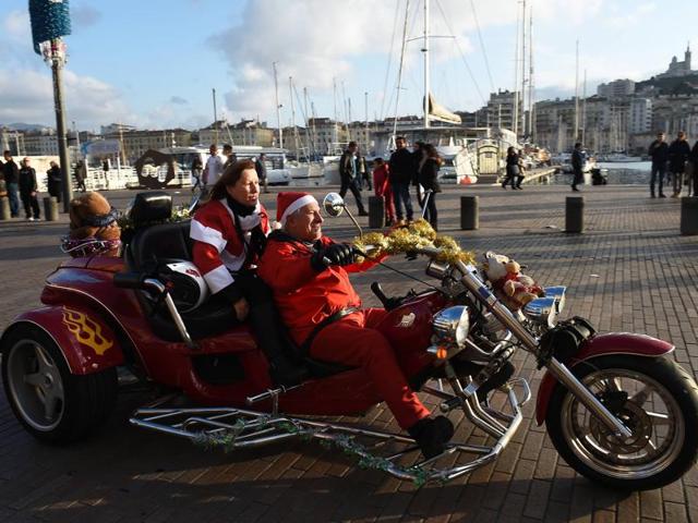 Two bikers, dressed as Santa Claus, with their collection of toys for children admitted in hospitals in Marseilles, France. (AFP) Two bikers, dressed as Santa Claus, with their collection of toys for children admitted in hospitals in Marseilles, France. (AFP)