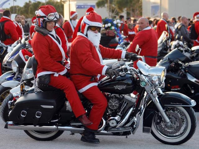 Members of the Sliders Massilia Motor Club, in Santa Claus costumes, on the Old-Port, in Marseille. Every rider brought a new toy for the children hospitalised in the public hospitals of Marseille area. (AP) Members of the Sliders Massilia Motor Club, in Santa Claus costumes, on the Old-Port, in Marseille. Every rider brought a new toy for the children hospitalised in the public hospitals of Marseille area. (AP)