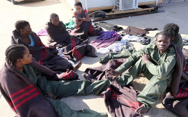 The rescued migrants at the naval base in Tripoli. (AFP Photo)