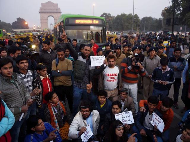 Hundreds of people shouted slogans for women’s safety in front of the iconic India Gate in New Delhi. (PTI Photo)