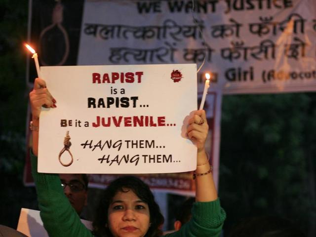 Student activist holding flayers with candles during a protesting against the release of juvenile convict of the 16 December Gang-rape, along with student activists at Jantar Mantar, in New Delhi, India, on Monday, December 21, 2015. (Hindustan Times) Student activist holding flayers with candles during a protesting against the release of juvenile convict of the 16 December Gang-rape, along with student activists at Jantar Mantar, in New Delhi, India, on Monday, December 21, 2015. (Hindustan Times)