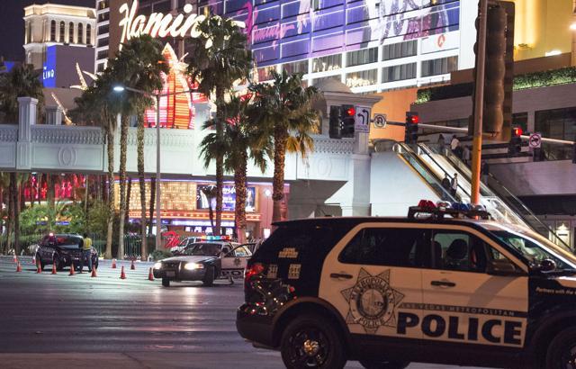 Police and local officials investigate a part of the Las Vegas Strip after the car ran into a group of pedestrians. (AFP photo) Police and local officials investigate a part of the Las Vegas Strip after the car ran into a group of pedestrians. (AFP photo)