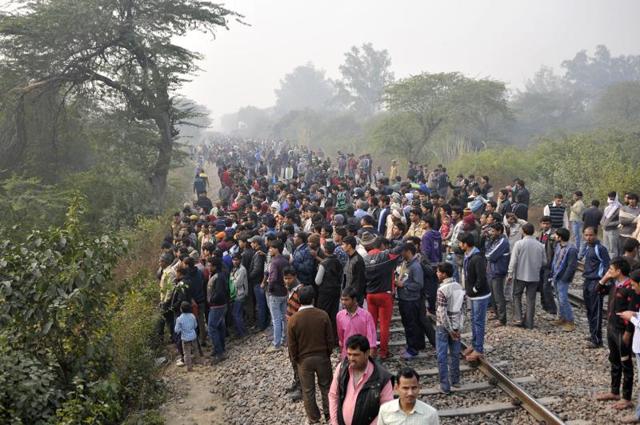 Residents gather near the crash site. (Vipin Kumar/HT Photo) Residents gather near the crash site. (Vipin Kumar/HT Photo)