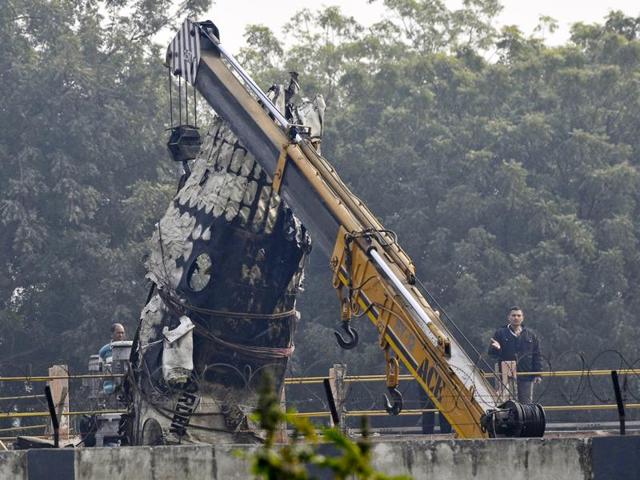 Wreckage of the Ranchi-bound BSF aircraft which narrowly missed an express train and crashed in west Delhi’s Dwarka area after developing a technical snag. (Vipin Kumar/Hindustan Times)