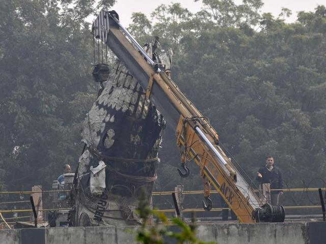 Wreckage of the Ranchi-bound BSF aircraft which narrowly missed an express train and crashed in west Delhi’s Dwarka area after developing a technical snag.(Vipin Kumar/HT Photo)