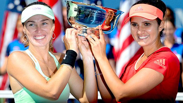 Martina Hingis and Sania Mirza with the 2015 US Open women's doubles trophy after beating Casey Dellacqua of Australia and Yaroslava Shvedova of Kazakhstan in the final at the USTA National Tennis Center in New York, on September 13, 2015. Martina Hingis and Sania Mirza with the 2015 US Open women's doubles trophy after beating Casey Dellacqua of Australia and Yaroslava Shvedova of Kazakhstan in the final at the USTA National Tennis Center in New York, on September 13, 2015.