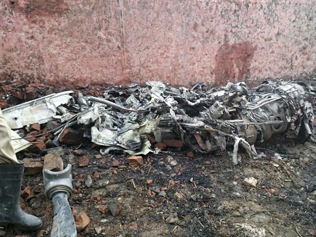 Rescue officials said the plane crashed just before the boundary wall of the airport near a railway crossing and the pilot may have tried to avoid residential areas to avoid more casualties. (HT Photo)