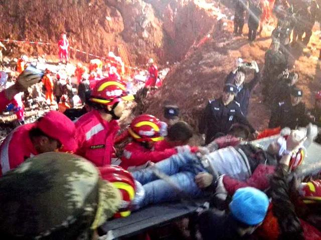 In this photo provided by China's Xinhua News Agency, a survivor is rescued at the site of landslide at an industrial park in Shenzhen, south China's Guangdong Province. (AP) In this photo provided by China's Xinhua News Agency, a survivor is rescued at the site of landslide at an industrial park in Shenzhen, south China's Guangdong Province. (AP)