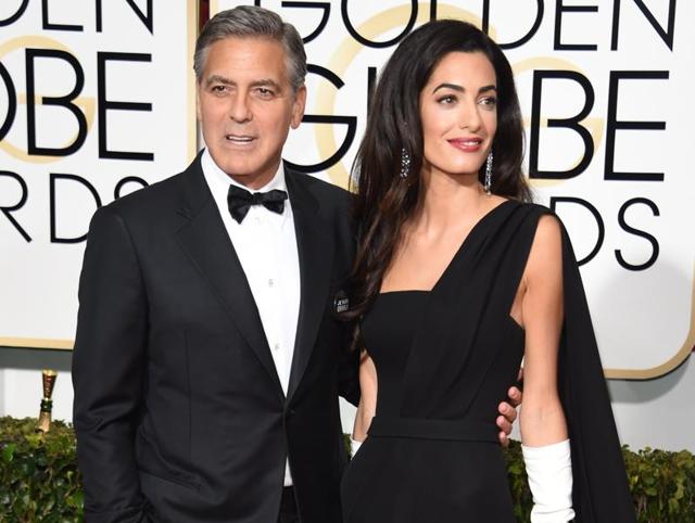 The recently married couple took to the red carpet at the Golden Globes hand in hand, one as elegant as the other. Dress code: black and white. (AFP)