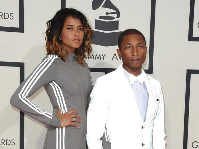 Pharrell Williams and his wife went for a more original approach, as is often the case with them, when they hit the red carpet for the Grammy Awards. A sporty outfit for her and a bermuda shorts ensemble for him. You never change a winning team. (AFP)