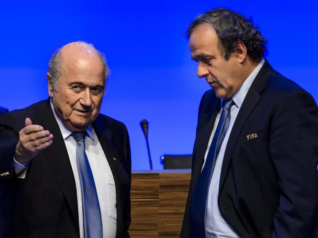 A file photo showing FIFA President Sepp Blatter listening to UEFA President Michel Platini during the 65th FIFA Congress in Zurich.(AFP Photo)