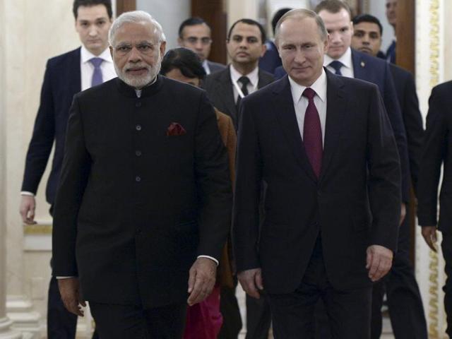 Vladimir Putin gifts Narendra Modi notes belonging to Mahatma Gandhi during their meeting in the Kremlin in Moscow, on December 23, 2015.(AP Photo) Vladimir Putin gifts Narendra Modi notes belonging to Mahatma Gandhi during their meeting in the Kremlin in Moscow, on December 23, 2015.(AP Photo)