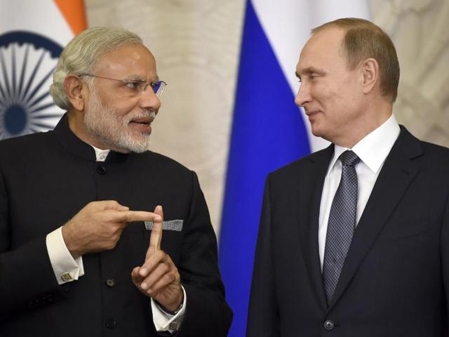 Russian President Vladimir Putin, right, and Indian Prime Minister Narendra Modi arrive to attend a meeting with Russian and Indian officials and businessmen in the Kremlin in Moscow.(AP) Russian President Vladimir Putin, right, and Indian Prime Minister Narendra Modi arrive to attend a meeting with Russian and Indian officials and businessmen in the Kremlin in Moscow.(AP)