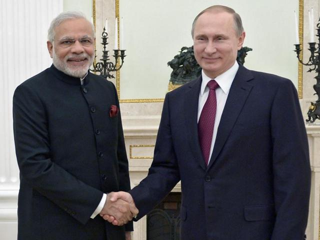 Russian President Vladimir Putin shakes hands with Indian PM Narendra Modi during their meeting in the Kremlin in Moscow on Wednesday.(AP) Russian President Vladimir Putin shakes hands with Indian PM Narendra Modi during their meeting in the Kremlin in Moscow on Wednesday.(AP)