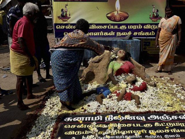 The fishermen community pay homage at a memorial of tsunami victims in Chennai. (PTI) The fishermen community pay homage at a memorial of tsunami victims in Chennai. (PTI)