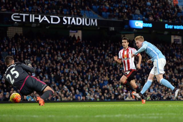 Manchester City's Belgian midfielder Kevin De Bruyne scores their fourth goal past Sunderland's Italian goalkeeper Vito Mannone during the English Premier League football match between Manchester City and Sunderland at The Etihad stadium. (AFP Photo) Manchester City's Belgian midfielder Kevin De Bruyne scores their fourth goal past Sunderland's Italian goalkeeper Vito Mannone during the English Premier League football match between Manchester City and Sunderland at The Etihad stadium. (AFP Photo)