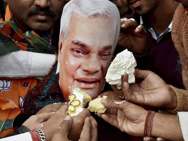 BJP activists celebrating former PM Atal Bihari Vajpayee's birthday in Patna on Friday. PM Modi visited Vajpayee’s residence on Friday night to wish him.(PTI)