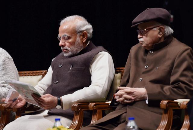 Prime Minister Narendra Modi with senior leader LK Advani at the BJP parliamentary board meeting in New Delhi.(PTI Photo)