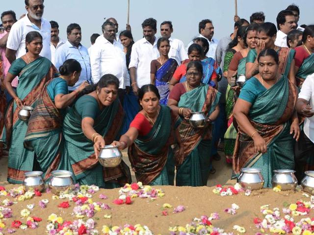 Women leave pots of milk as offerings during a ceremony for the victims of the 2004 earthquake and tsunami, at Marina Beach in Chennai. (AFP) Women leave pots of milk as offerings during a ceremony for the victims of the 2004 earthquake and tsunami, at Marina Beach in Chennai. (AFP)