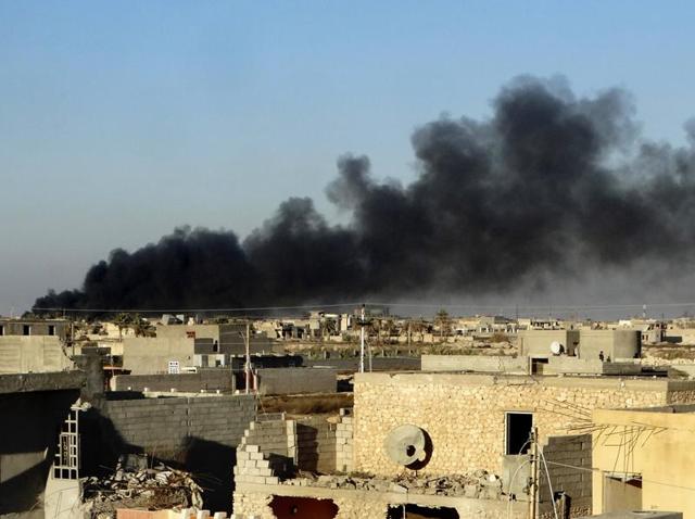 In this Friday, Dec. 25, 2015 photo, smoke rises from Islamic State positions following a US-led coalition airstrike as Iraqi Security forces advance their position in downtown Ramadi. (AP) In this Friday, Dec. 25, 2015 photo, smoke rises from Islamic State positions following a US-led coalition airstrike as Iraqi Security forces advance their position in downtown Ramadi. (AP)