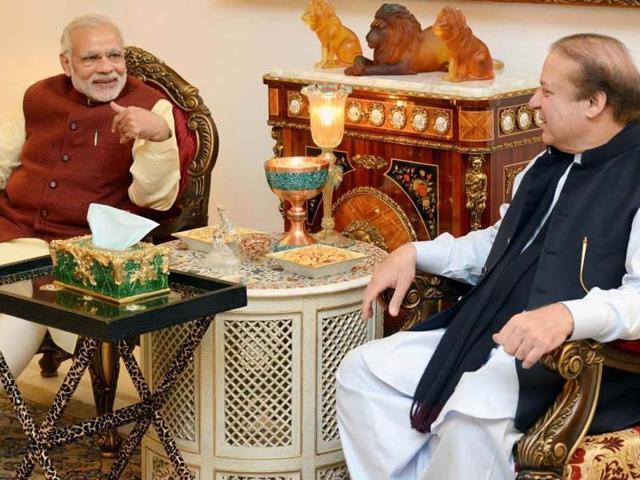 Indian Prime Minister, Narendra Modi and Pakistan Prime Minister, Nawaz Sharif look on during a meeting in Lahore.(AFP Photo)