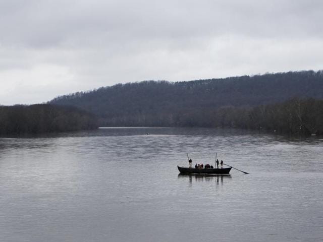 A group of Revolutionary War re-enactors row a Durham boat during the re-enactment of Washington crossing the Delaware River. (AP) A group of Revolutionary War re-enactors row a Durham boat during the re-enactment of Washington crossing the Delaware River. (AP)