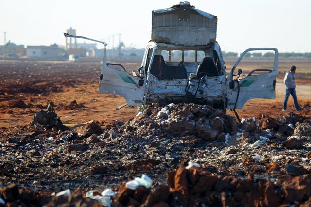 A man walks near a damaged truck at a site hit by what activists said were airstrikes carried out by the Russian air force in Syria. Russia has denied that its airstrikes have hit civilian targets. (REUTERS Photo) A man walks near a damaged truck at a site hit by what activists said were airstrikes carried out by the Russian air force in Syria. Russia has denied that its airstrikes have hit civilian targets. (REUTERS Photo)