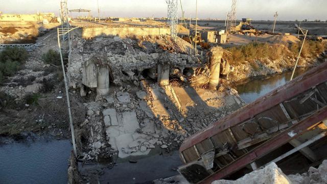 A bridge destroyed by the Islamic State group to block Iraqi security forces from moving forward in Ramadi, 70 miles (115 kilometers) west of Baghdad. (AP) A bridge destroyed by the Islamic State group to block Iraqi security forces from moving forward in Ramadi, 70 miles (115 kilometers) west of Baghdad. (AP)