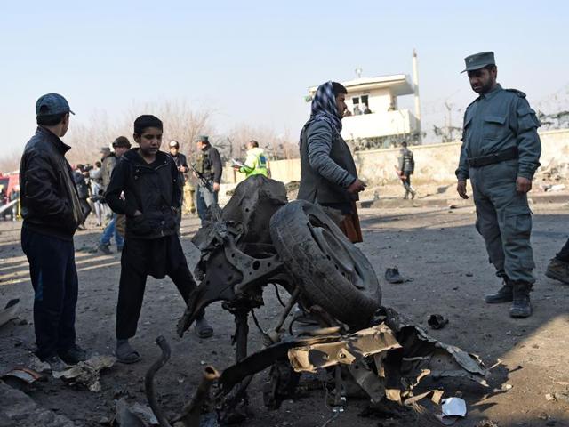 An Afghan policeman looks at the wreckage of a car which was used in a suicide car bomb near the international airport, in Kabul on December 28, 2015. A Taliban bomber has detonated an explosives-packed vehicle near Kabul airport in an attack on a NATO convoy, killing one civilian. (AFP) An Afghan policeman looks at the wreckage of a car which was used in a suicide car bomb near the international airport, in Kabul on December 28, 2015. A Taliban bomber has detonated an explosives-packed vehicle near Kabul airport in an attack on a NATO convoy, killing one civilian. (AFP)