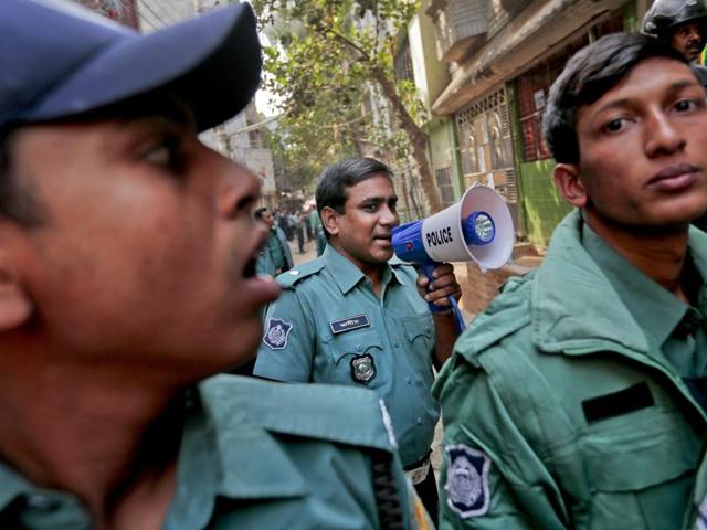 Bangladeshi police officials secure the area during a raid on a building where members of a banned Islamist group were detained. Two suspected militants were killed in an explosion outside the capital of Dhaka after security forces continued to conduct raids against extremist hideouts.(AP Photo) Bangladeshi police officials secure the area during a raid on a building where members of a banned Islamist group were detained. Two suspected militants were killed in an explosion outside the capital of Dhaka after security forces continued to conduct raids against extremist hideouts.(AP Photo)