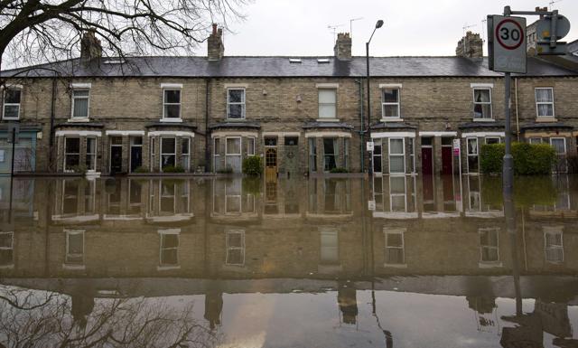 A flooded residential street next to the River Foss is pictured after it burst it's banks in York. (AFP) A flooded residential street next to the River Foss is pictured after it burst it's banks in York. (AFP)