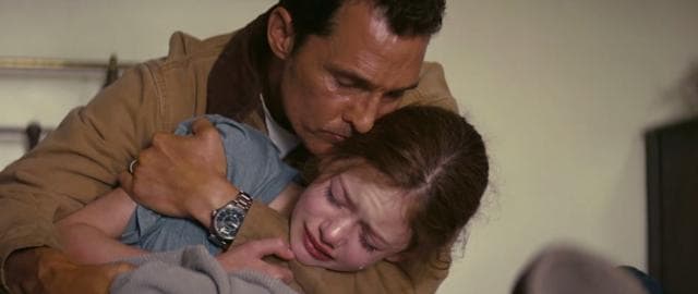 Matthew McConaughey comforts Murph in Interstellar.