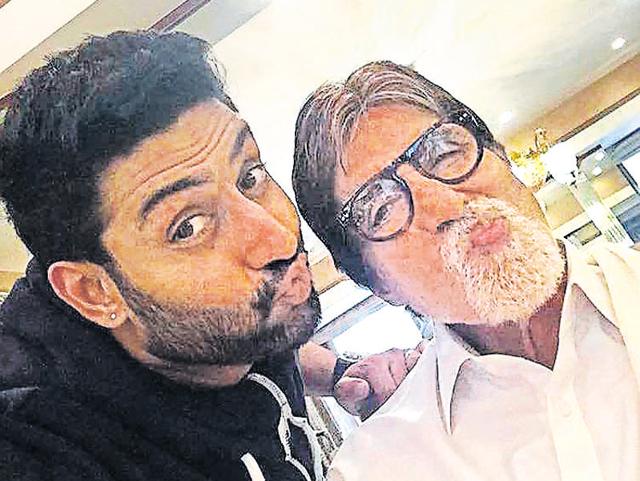 Amitabh Bachchan and Abhishek Bachchan: The father-son duo looked absolutely adorable as they puckered up for the camera. Big B shared this photo on Twitter and wrote, “T 1949 - When your son starts wearing your shoes he is no longer a son he is your friend .. my friend, Abhishek (sic).”
